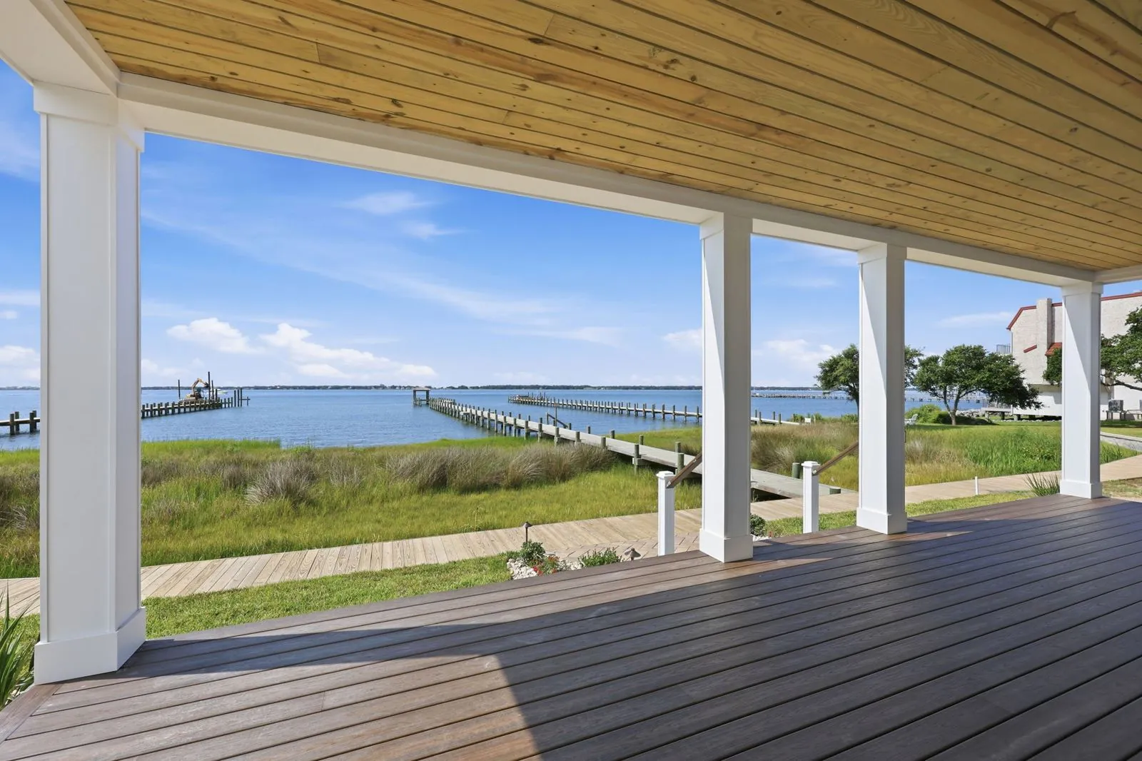 Lower covered porch and boardwalk to the dock